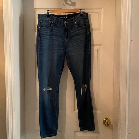 Great condition super skinny mid rise Express jeans. Ripped at knees. Size 12